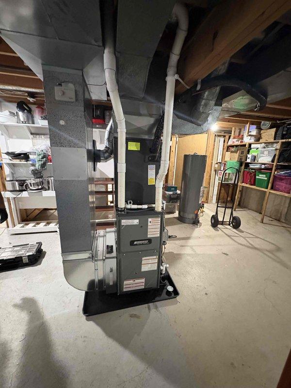 Successfully completed full HVAC system installation including new furnace unit and residential water heater. Furnace installed in basement utility area on proper platform with all required PVC venting routed through ceiling joists and connected to existing ductwork system. Water heater installed in upper-level utility space with copper supply lines, brass shut-off valves, and metallic flex venting properly secured. All electrical connections completed to code, gas lines tested for leaks, and systems fully operational upon departure.
