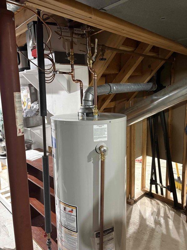 Successfully completed full HVAC system installation including new furnace unit and residential water heater. Furnace installed in basement utility area on proper platform with all required PVC venting routed through ceiling joists and connected to existing ductwork system. Water heater installed in upper-level utility space with copper supply lines, brass shut-off valves, and metallic flex venting properly secured. All electrical connections completed to code, gas lines tested for leaks, and systems fully operational upon departure.