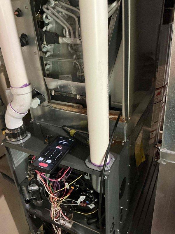 Responded to no cooling complaint on Bryant HVAC system with reported flooding. Upon inspection, discovered water intrusion had affected the air handler unit, causing system shutdown. Documented interior components including control board, refrigerant lines, and electrical connections, all of which showed exposure to moisture. Observed water damage on surrounding walls with visible deterioration, cracking, and separation at wall junctions, confirming the extent of the leak. Photographed affected areas including compromised wall surfaces and damaged interior mechanical room conditions. System required assessment for water damage to electrical components and potential replacement of affected parts to restore cooling operation.