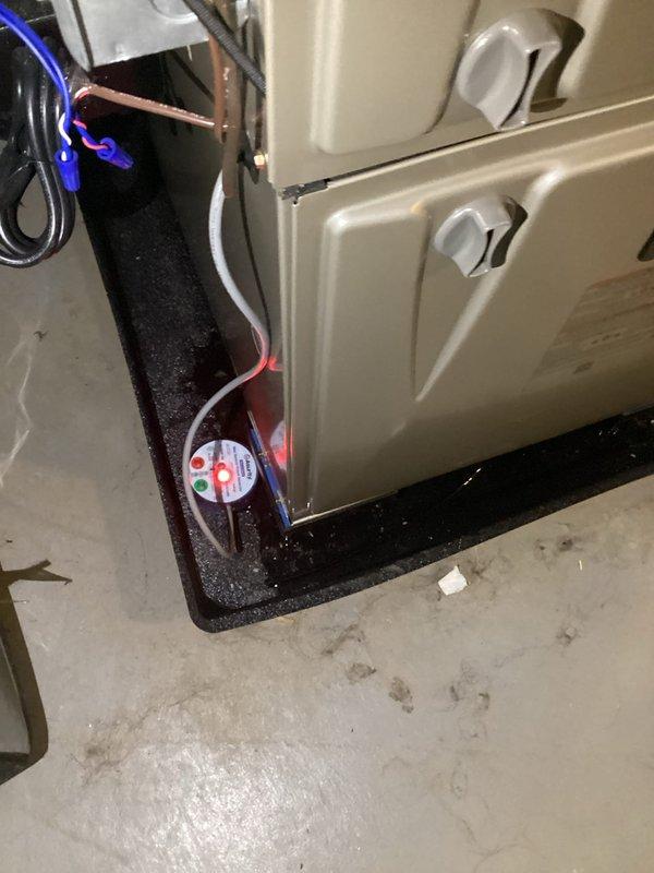 Responded to service call for Carrier Infinity unit not cooling with water found in drain pan. Upon arrival, inspected HVAC system and confirmed water accumulation in condensate pan with visible moisture on surrounding floor surfaces. Evaluated condensate drainage system and identified blockage preventing proper water evacuation. Cleared condensate line obstruction and verified proper drainage flow. Tested unit operation and confirmed cooling function restored with condensate draining correctly through primary drain line. System operating within normal parameters upon departure.