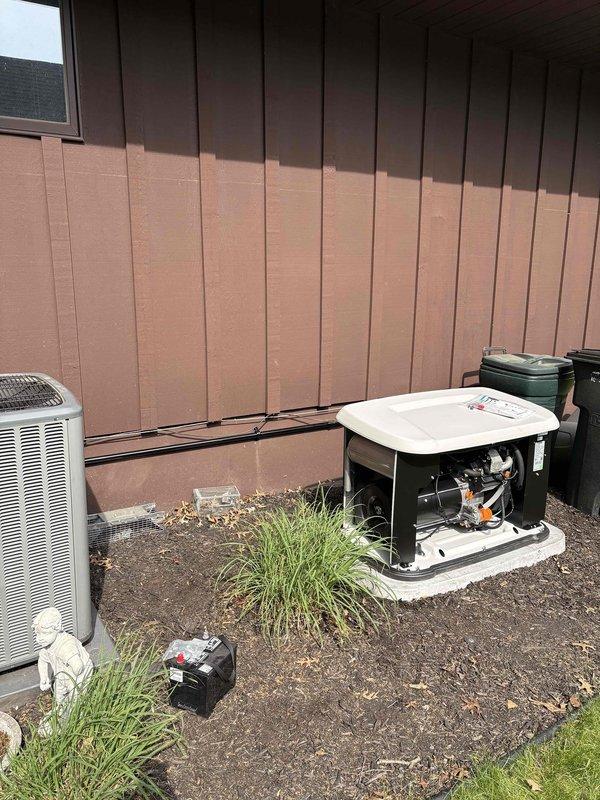 Successfully installed a 14KW standby generator with 150A automatic transfer switch at residential property. Coordinated utility disconnect and reconnect services to safely complete electrical connections, obtained and passed electrical permit inspection, and completed all required municipal permitting requirements. Generator unit was positioned on concrete pad in exterior utility area alongside existing HVAC equipment, with proper clearances maintained for ventilation and service access. Installed all necessary fuel lines, electrical conduit, and transfer switch wiring per manufacturer specifications and local electrical code. System was tested for proper operation including automatic transfer functionality and verified all connections were secure and weatherproof.