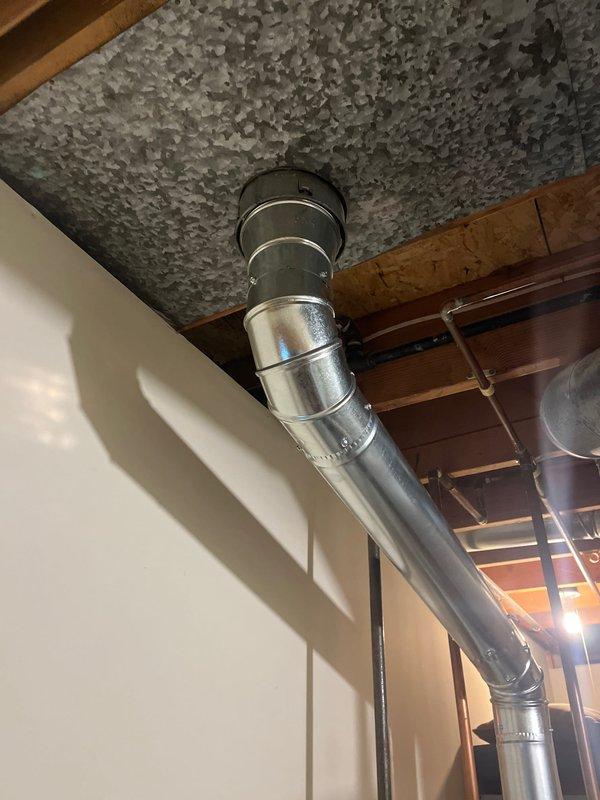 Successfully installed a 40-gallon natural gas water heater in the residential mechanical room. The unit was positioned alongside existing HVAC equipment with proper clearance for maintenance access. Connected metallic exhaust venting through the ceiling with secure mounting flange and proper sealing at all joints. Verified all gas connections, tested for leaks, and ensured proper draft operation through the venting system. Unit was filled, fired, and tested for proper operation with all safety controls functioning as designed.