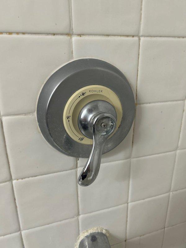Responded to service call for two plumbing issues. Inspected Kohler shower valve control experiencing pressure reduction when temperature was adjusted from maximum heat setting; diagnosed pressure-balancing cartridge issue affecting water flow at lower temperature settings. Evaluated non-functioning garbage disposal unit under kitchen sink and provided quote for removal and replacement with standard P-trap drain assembly per client request. Documented existing conditions of both fixtures with photographs for service records.