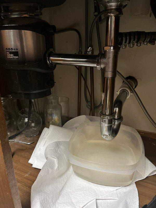 Responded to service call for two plumbing issues. Inspected Kohler shower valve control experiencing pressure reduction when temperature was adjusted from maximum heat setting; diagnosed pressure-balancing cartridge issue affecting water flow at lower temperature settings. Evaluated non-functioning garbage disposal unit under kitchen sink and provided quote for removal and replacement with standard P-trap drain assembly per client request. Documented existing conditions of both fixtures with photographs for service records.