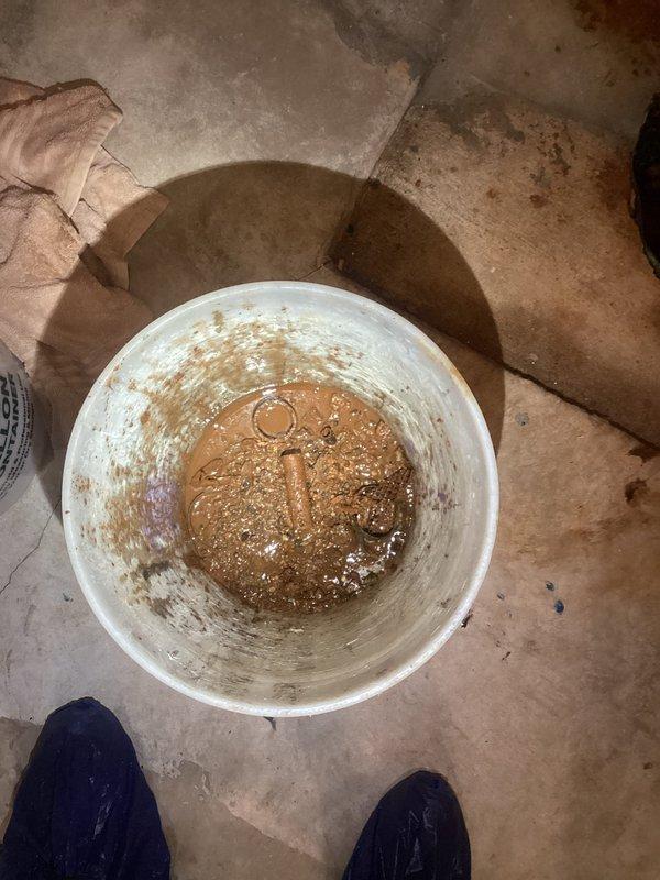 Responded to sump pump service call and found system operating with excessive sediment accumulation in basin. Inspected sump pump assembly, float switch mechanism, and discharge piping for proper operation. Basin contained significant debris and murky water with visible particulate matter affecting pump performance. Verified pump activation cycle and float switch functionality. System showed signs of heavy sediment buildup requiring attention to prevent future operational issues.