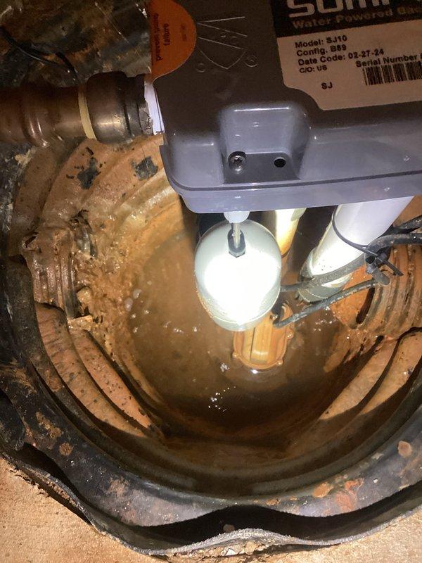 Responded to sump pump service call and found system operating with excessive sediment accumulation in basin. Inspected sump pump assembly, float switch mechanism, and discharge piping for proper operation. Basin contained significant debris and murky water with visible particulate matter affecting pump performance. Verified pump activation cycle and float switch functionality. System showed signs of heavy sediment buildup requiring attention to prevent future operational issues.