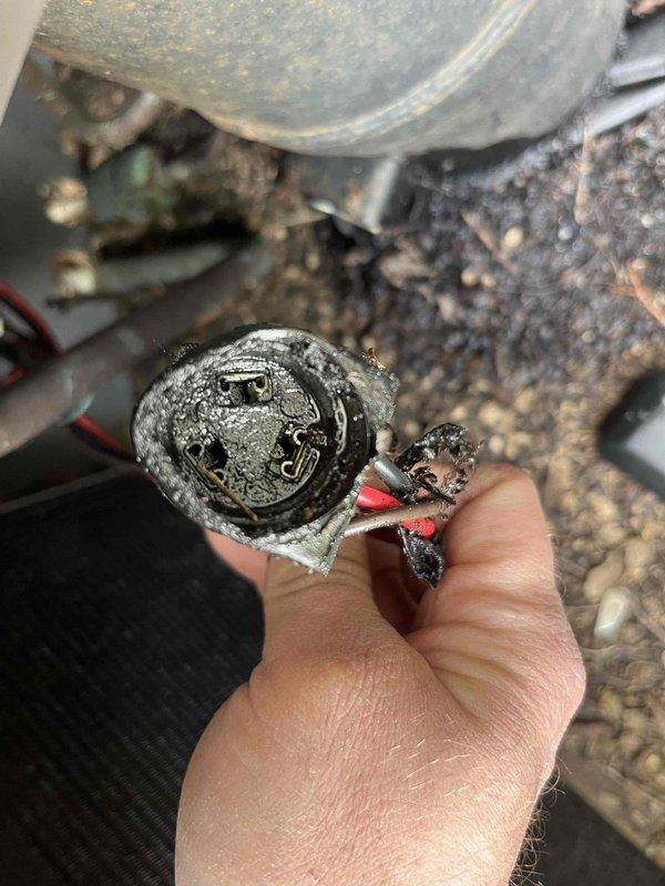 # AC Repair - Capacitor Replacement

Responded to service call for air conditioning unit not cooling to desired temperature. Upon inspection, found 23-year-old system with failed dual run capacitor exhibiting severe corrosion, oxidation, and physical deterioration. Capacitor showed extensive weathering with compromised insulation, corroded terminal connections, and damaged wire leads. Heavy rust and mineral deposits present on contactor assembly and surrounding electrical components indicated prolonged exposure to environmental conditions and end of component service life.

Removed failed capacitor and replaced with new unit meeting manufacturer specifications. Cleaned corroded electrical connections and contactor terminals. Verified proper electrical connections and system operation. Unit tested successfully with compressor and condenser fan motor operating at normal parameters. System now cooling properly to thermostat setpoint.