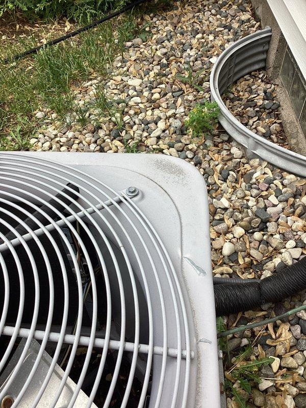 # No Cool Service Call - 17-Year-Old Carrier AC Unit

Responded to a no cool condition on a 17-year-old Carrier air conditioning system. Upon arrival, performed visual inspection of outdoor condenser unit, which appeared to be in fair physical condition with signs of age-related wear on the fan grille and housing. Unit was properly installed on concrete pad with adequate clearance and landscaping. Conducted diagnostic testing to identify cause of system failure. Documented equipment condition and installation setup with photographs for service records. Customer notified of findings and system status upon completion of diagnostic evaluation.