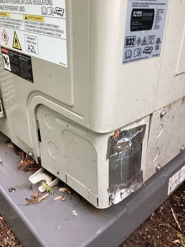 Completed annual cooling maintenance on outdoor R32 refrigerant heat pump system. Performed comprehensive tune-up inspection including electrical connections, refrigerant levels, and operational testing. Noted existing damage to lower exterior panel previously repaired with foil tape; unit remains functional and operating within normal parameters.