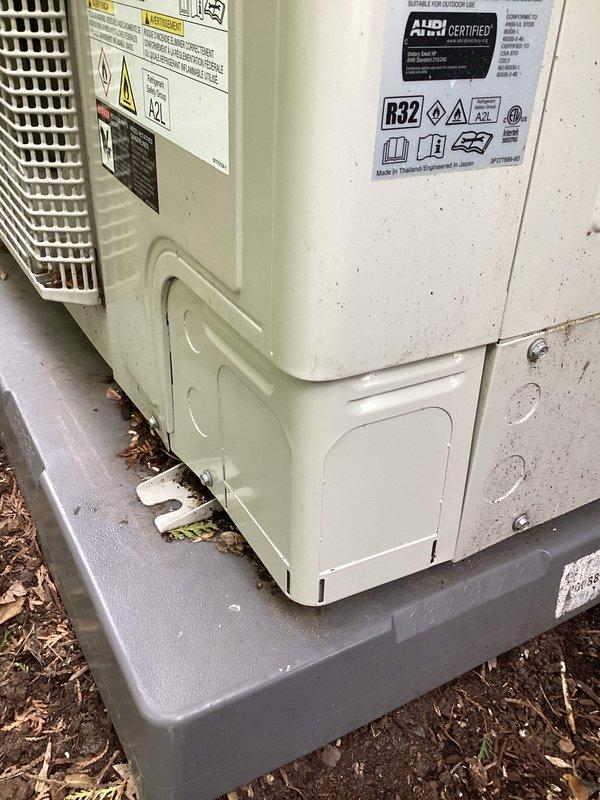 Completed annual cooling maintenance on outdoor R32 refrigerant heat pump system. Performed comprehensive tune-up inspection including electrical connections, refrigerant levels, and operational testing. Noted existing damage to lower exterior panel previously repaired with foil tape; unit remains functional and operating within normal parameters.