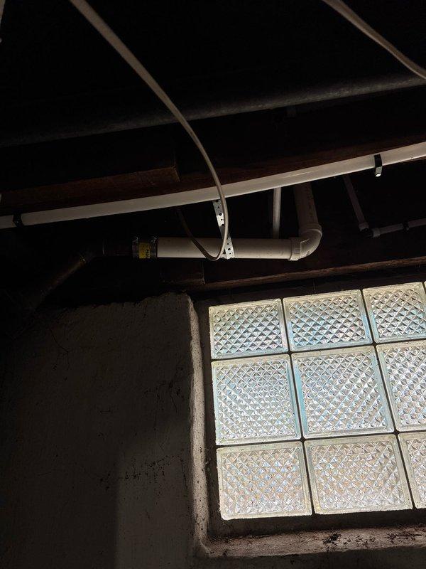 Installed new water supply line to refrigerator location, routing PVC piping along basement ceiling joists with proper support brackets. Completed drain line modifications for kitchen sink, connecting to existing cast iron waste stack. All connections tested and verified leak-free upon completion.