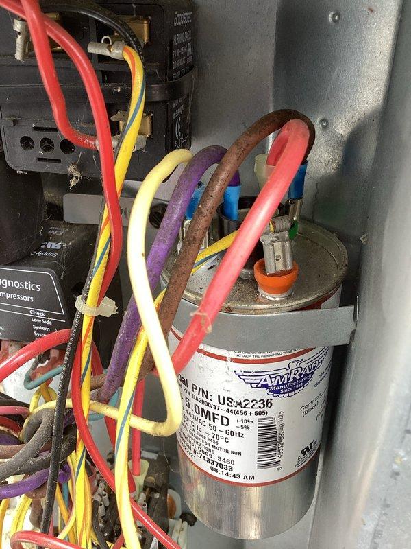 Responded to no cooling complaint on 6-year-old EnergiAir system with warranty through July 2029. Upon inspection, found severely corroded wire connection at capacitor terminal causing system failure. Replaced damaged capacitor and corroded wiring, verified all electrical connections, and restored system to proper cooling operation.