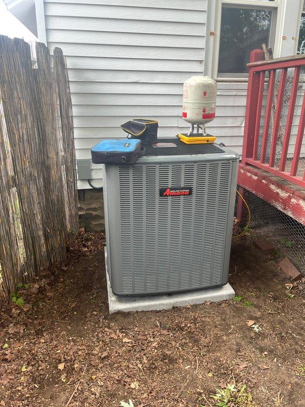 Completed full HVAC system replacement including installation of new Amana outdoor condensing unit positioned on concrete pad with proper clearances, new indoor gas furnace with associated ductwork connections, and humidifier integration. Installed new PVC condensate drain lines and ventilation piping throughout basement mechanical room. Performed heat run to verify furnace operation, airflow, and system cycling. All equipment secured, labeled, and tested for proper function. System commissioned and operational.