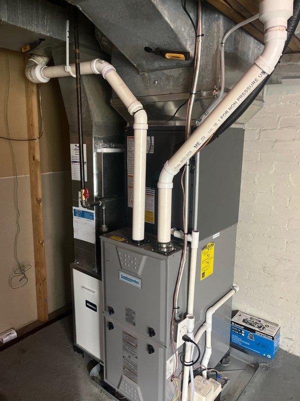 Completed full HVAC system replacement including installation of new Amana outdoor condensing unit positioned on concrete pad with proper clearances, new indoor gas furnace with associated ductwork connections, and humidifier integration. Installed new PVC condensate drain lines and ventilation piping throughout basement mechanical room. Performed heat run to verify furnace operation, airflow, and system cycling. All equipment secured, labeled, and tested for proper function. System commissioned and operational.