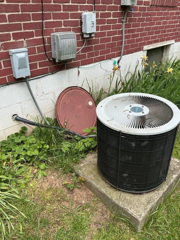 Responded to no cooling complaint on 26-year-old Comfortmaker central air conditioning system serving entire residence. Upon inspection, outdoor condensing unit showed signs of age and minimal recent maintenance with overgrown vegetation surrounding equipment. Performed diagnostic evaluation of system components, documented equipment condition with photographs for service records, and assessed unit performance. Customer advised of findings and recommendations for restoring cooling operation to the home.