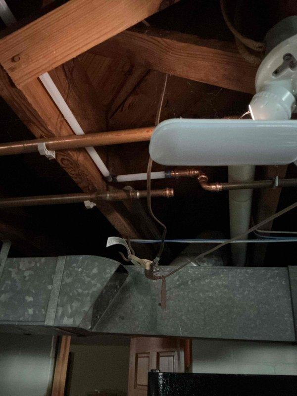 Installed high-efficiency water softener system in basement utility area with complete copper piping connections and main line ball valve integration. Replaced water heater anode rod during service visit and coordinated installation timing with municipal water main valve work. All plumbing connections tested and verified operational with proper water flow to new softening system.