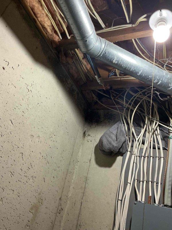Responded to a call for a leaking exterior spigot causing water infiltration into the basement. Upon inspection, located the failed hose bib on the exterior wall near the utility meter installation and traced the supply line through the basement ceiling where active leaking was observed along the copper piping. Completed necessary repairs to the spigot assembly and verified all connections were secure with no further water discharge into the basement area.