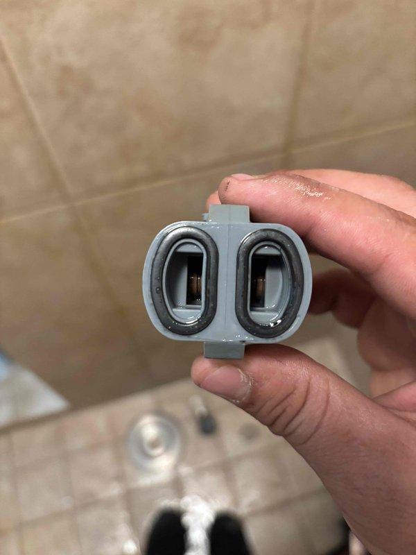 Responded to master bathroom shower that had been continuously running for two days. Upon inspection, found the shower control valve unable to be removed due to a corroded mounting screw. Successfully extracted the failed cartridge assembly from the shower valve body and replaced it with a new unit, restoring proper shut-off functionality and stopping the continuous water flow.