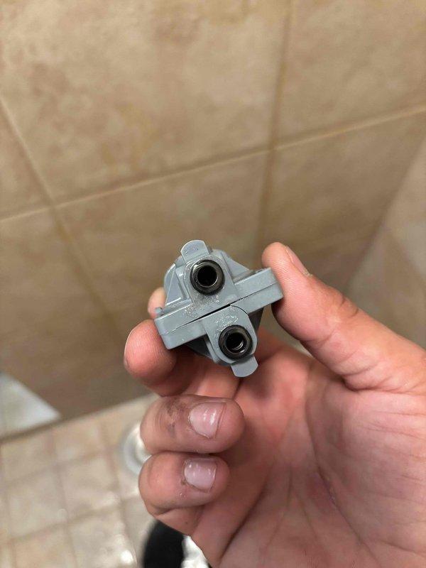 Responded to master bathroom shower that had been continuously running for two days. Upon inspection, found the shower control valve unable to be removed due to a corroded mounting screw. Successfully extracted the failed cartridge assembly from the shower valve body and replaced it with a new unit, restoring proper shut-off functionality and stopping the continuous water flow.