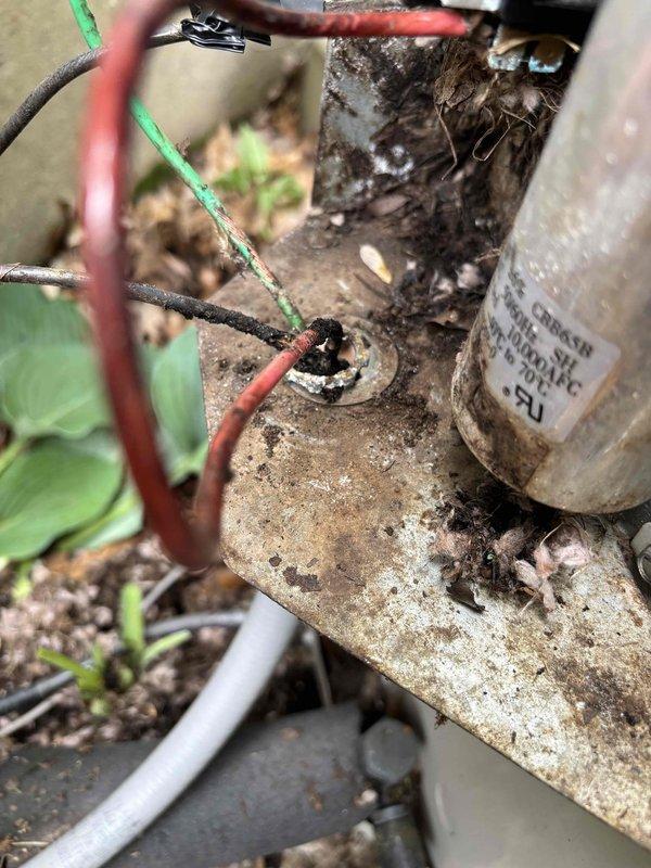 # Air Conditioning No Cooling - Capacitor Failure

Responded to service call for air conditioning system running but not cooling. Upon arrival, performed diagnostic evaluation of 6-year-old EcoAir system. Visual inspection revealed failed dual-run capacitor with visible signs of deterioration, including surface discoloration, rust staining, and age-related degradation. Capacitor tested at CBB65B 370V 50/10µFD specification showed complete failure, preventing compressor from operating at proper capacity.

Removed defective capacitor and replaced with new OEM-equivalent component matching original specifications. Verified all electrical connections, secured wiring at junction points, and confirmed proper grounding. Cycled system through complete operational test. Compressor engaged properly, refrigerant pressures stabilized within normal range, and airflow temperature at registers confirmed adequate cooling restoration. System returned to normal operation. Recommended routine maintenance