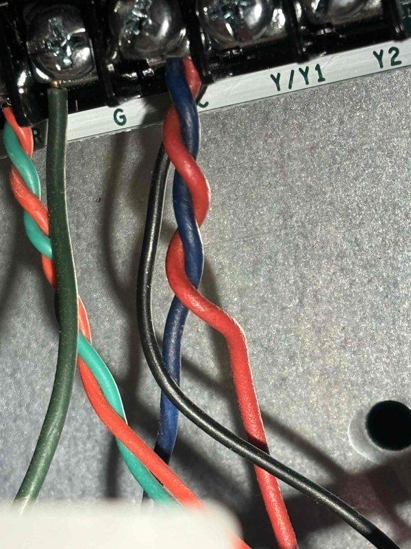 Responded to no-cooling complaint on newly installed EnergiAir system that had never operated since January installation. Upon inspection, found improper wiring connections at the thermostat terminal block affecting Y/Y1 and Y2 compressor call circuits. Corrected all low-voltage wiring connections per manufacturer specifications, verified proper wire terminations at control board, and confirmed 24VAC signal path to outdoor unit. Tested system operation through complete cooling cycle, verified proper compressor engagement, and confirmed adequate airflow throughout home. System now functioning as designed with all zones cooling properly.