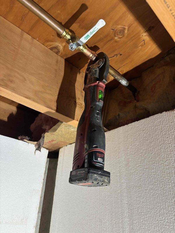 Responded to plumbing leak issue where exterior hose spigot was leaking into crawl space. Accessed crawl space and located corroded copper pipe supply line feeding the outdoor faucet with no existing shutoff valve. Installed new brass shutoff valve on the water supply line to provide isolation capability for the exterior spigot, preventing future leaks from entering the crawl space and allowing for easier maintenance and winterization of the outdoor faucet.