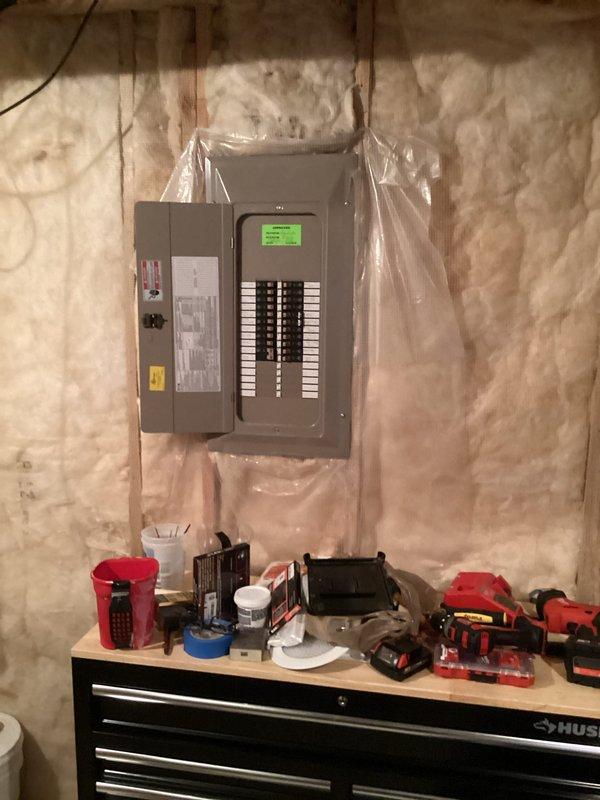 Conducted site assessment for standby generator installation at residential property. Evaluated existing electrical panel configuration in basement utility area, documented current electrical infrastructure including main service panel with digital display and circuit breaker arrangement. Assessed available space and electrical connections required for generator integration with home's power system. Photographed electrical panel location, surrounding utility area conditions, and workspace to develop comprehensive installation estimate for automatic transfer switch and generator system.