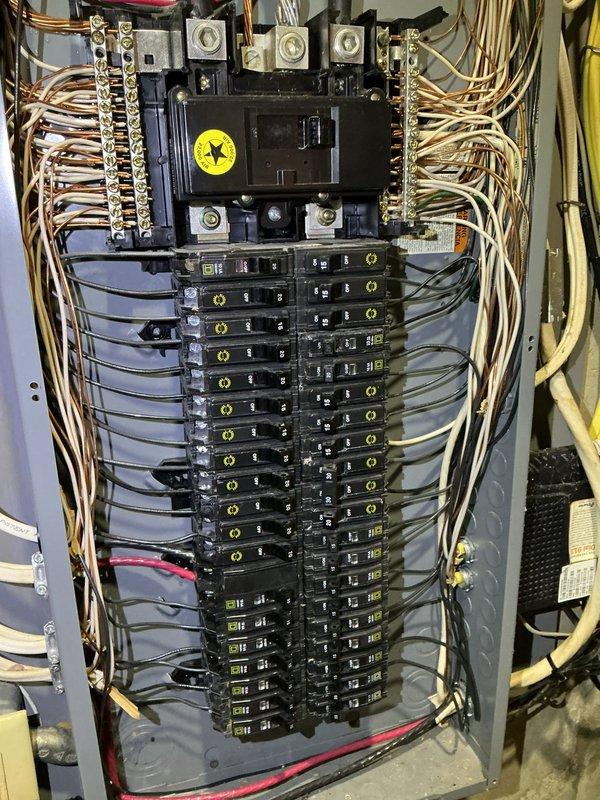 Responded to emergency service call after outdoor spigot failure caused water intrusion into electrical panel during AC maintenance. Performed comprehensive electrical safety inspection of main distribution panel, examining all circuit breakers, bus bars, wire connections, and main disconnect for water damage, corrosion, or compromised components. Documented panel condition with detailed photography showing wire routing, terminal connections, and breaker configuration. All electrical components inspected and found to be functioning properly with no evidence of water damage or safety concerns requiring immediate remediation.