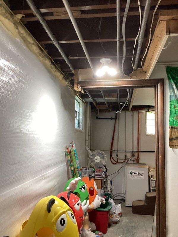 Responded to service call for lack of hot water at bathroom sink. Upon inspection, traced supply lines through basement utility area and identified issue with hot water supply valve or connection serving the bathroom fixture. Restored hot water flow to bathroom sink and verified proper operation upon completion.