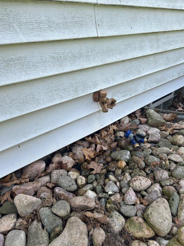 Responded to multiple plumbing leak issues including a leaking outdoor spigot previously replaced in 2023 and a leaking furnace condensate drain line in the crawl space. Assessed standing water accumulation approximately one foot from the drain area and inspected drainage system for proper function. Additional service requests included evaluation of a toilet that runs intermittently after flushing and consultation for bidet seat installation.