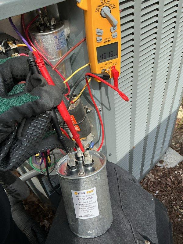 Completed annual cooling maintenance on 2015 EnergiAir system under active warranty coverage. Performed comprehensive inspection of evaporator coil assembly, verified proper refrigerant flow through serpentine coil configuration, and confirmed insulation integrity within air handler chamber. Conducted electrical diagnostics using digital multimeter on TITAN PRO capacitor (model TRCFD450), obtaining readings of 35.15 microfarads which fall within acceptable operating parameters for the compressor circuit. All electrical connections, terminals, and wire routing inspected and found secure with no signs of degradation or overheating.