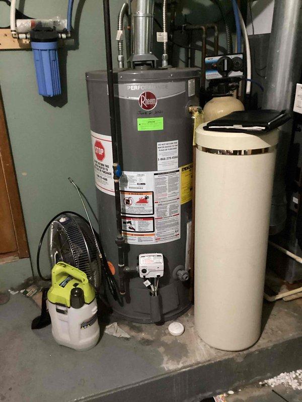 Completed estimate for water heater replacement options on existing chimney-vented natural gas unit. Evaluated current Rheem Performance atmospheric vent water heater manufactured May 2021 with Category I natural draft venting configuration. Assessed feasibility of converting to power vent gas, B-vent gas, or electric water heater based on existing infrastructure including water softener system and utility room layout. Documented equipment specifications and provided customer with multiple replacement options to accommodate venting preferences.
