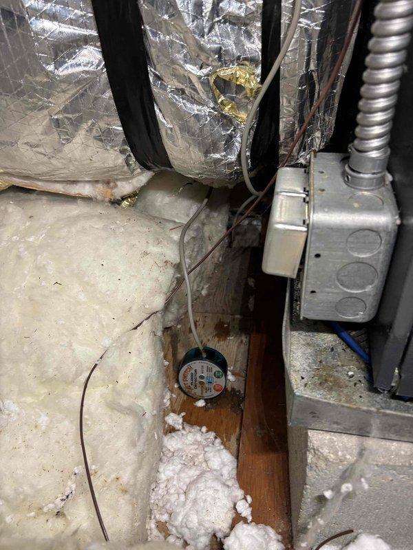Responded to service call for blinking indicator light and water leakage from attic area on dual 18-year-old Goodman HVAC systems. Upon inspection, identified condensate drain issue causing water accumulation in emergency overflow pan. Cleared primary drain line blockage, verified proper drainage flow, and tested secondary safety switch operation. Confirmed both systems operating normally with no further leakage detected.