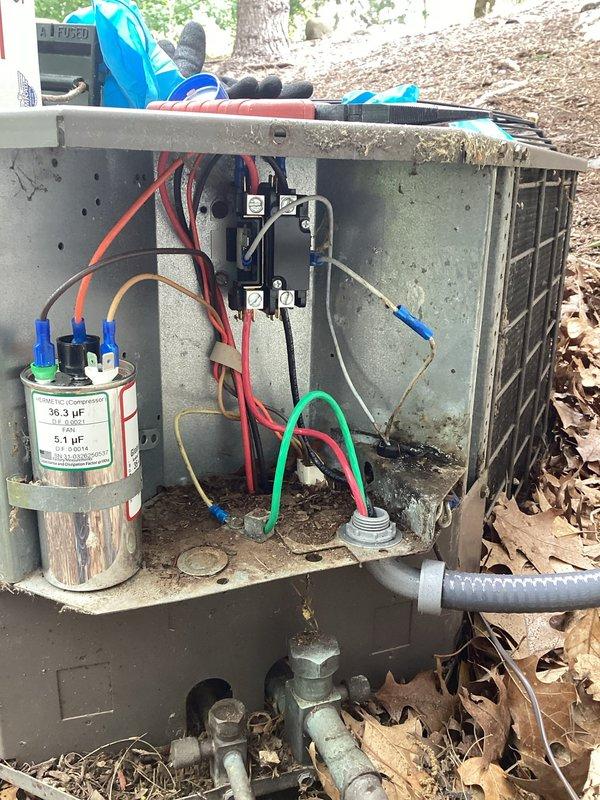 Responded to no cooling complaint on outdoor condensing unit. Upon inspection, found electrical compartment accessible for diagnostic evaluation. Verified dual-run capacitor connections and contactor operation. Unit showed signs of extended service without routine maintenance, with debris accumulation around base and coil area. Documented electrical components and exterior disconnect box condition. Customer declined filter replacement and ongoing preventative maintenance services due to upcoming relocation.
