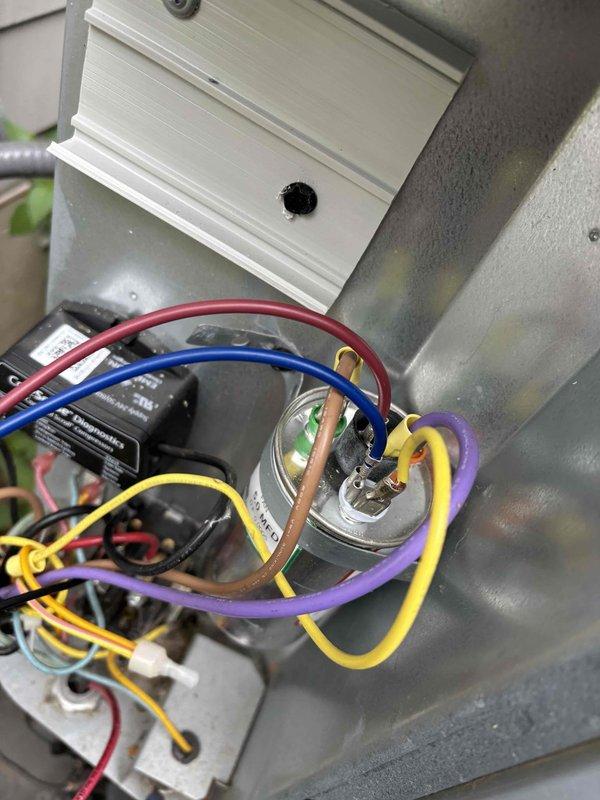 Responded to no-cooling call on 2-year-old Daikin system where thermostat was calling for cooling but outdoor condenser unit was not operating. Upon inspection, diagnosed failed dual-run capacitor preventing compressor and condenser fan motor operation. Replaced defective capacitor with properly rated replacement unit, restored power, and verified system operation with condenser fan spinning and compressor running normally. Tested system through complete cooling cycle to confirm proper operation and adequate airflow. Discussed customer inquiry regarding potential zoned cooling installation and additional vent placement for future consideration.