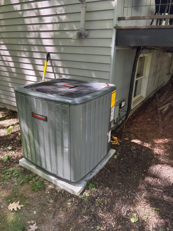 Completed full air conditioning system replacement including outdoor condenser unit and associated components. Installed new outdoor condensing unit on existing concrete pad with proper leveling and secured all refrigerant line sets using copper tubing routed along exterior wall and through crawl space access. Mounted and secured black flexible refrigerant line insulation and copper piping to building structure using appropriate mounting hardware and strapping. Connected electrical disconnect box to new unit and verified all electrical connections meet code requirements. Tested system operation, confirmed proper refrigerant charge, and verified all connections are secure and leak-free.