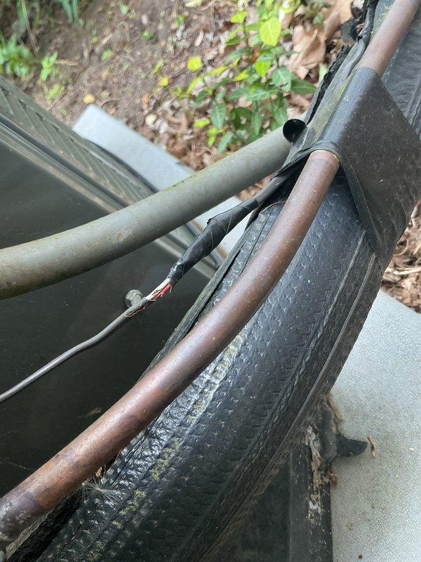 Completed annual cooling maintenance on 3-year-old Trane system with customer reporting inadequate cooling performance. Performed comprehensive system inspection including outdoor unit refrigerant lines, electrical connections, and indoor condensate management components. Identified damaged electrical wiring at outdoor unit with compromised insulation exposing conductors, presenting potential safety hazard and contributing to performance issues. Inspected condensate pump assembly and drainage system at indoor air handler, verifying proper operation and clearance. Checked refrigerant line insulation integrity and connections. System evaluated for cooling capacity and operational efficiency to address reported inadequate temperature control concerns.