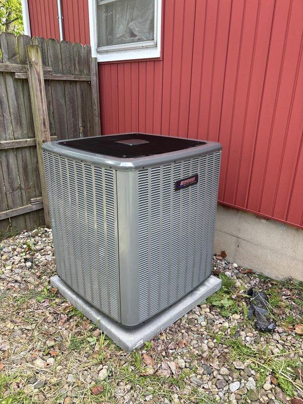 Completed full air conditioning system replacement at residential property. New outdoor condensing unit installed on composite base pad against exterior wall with proper clearances maintained. System charged with refrigerant per manufacturer specifications showing factory charge of 87 oz with field charge of 9 oz for total system charge of 87 oz. All electrical connections completed, copper line set installed with proper insulation, and unit tested for proper operation. Michigan Saves financing documentation processed and submitted for approval.