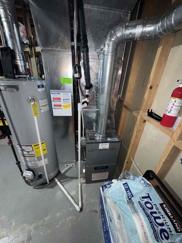 Responded to service call for York air conditioning system with no cooling. Performed diagnostic assessment of 7-year-old unit and documented existing HVAC equipment configuration including furnace, ductwork, and utility room layout. Completed visual inspection and photographic documentation of equipment condition to provide estimate for repair recommendations.