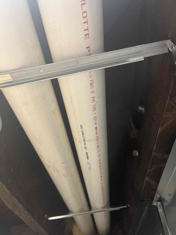 Completed inspector-requested corrections to high-efficiency furnace venting system. Corrected 2' section of level vent pipe to achieve minimum 1/4" per foot upward slope from furnace to termination point, installed proper support brackets at required 4' intervals throughout approximately 5' of PVC vent piping, and documented all corrections with photographs for remote inspection approval.