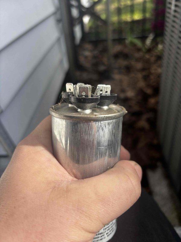 Responded to cooling complaint on EnergiAir system installed in 2024 experiencing inadequate temperature reduction. Unit was running continuously but failing to lower indoor temperature from 73°F to setpoint of 68°F after extended operation. Upon inspection, diagnosed failed dual-run capacitor as root cause of reduced cooling capacity. Removed defective capacitor and installed replacement unit, restoring proper compressor and condenser fan motor operation. Verified system cooling performance and confirmed unit achieving proper temperature differential at supply registers.