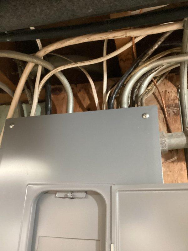 Provided estimate for replacement of 1988 Trane R-22 outdoor condensing unit and matching indoor evaporator coil with new two-stage AC system utilizing current refrigerant technology. Assessed compatibility of existing 2005 Goodman GMS9/GCS9 gas furnace with single-speed PSC blower for integration with proposed modern AC equipment. Evaluated trunk-and-branch ductwork configuration in basement for installation of two-zone control system with motorized dampers, designating Zone 1 for upstairs and Zone 2 for main floor plus basement. Recommended bypass damper solution for static pressure management due to single-speed blower limitation, as blower modulation not feasible with existing PSC motor. Specified smart thermostat configuration supporting two-stage cooling with Y1/Y2 signaling capability for proper system staging and zone control.