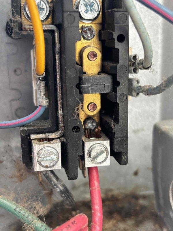 Completed annual cooling maintenance on 13-year-old air conditioning system. Performed comprehensive inspection of electrical components, including contactor assembly and terminal connections. Documented existing conditions showing normal age-related wear, minor oxidation on brass terminals, and dust accumulation within electrical enclosure. All wire connections verified secure, system operational and ready for cooling season.