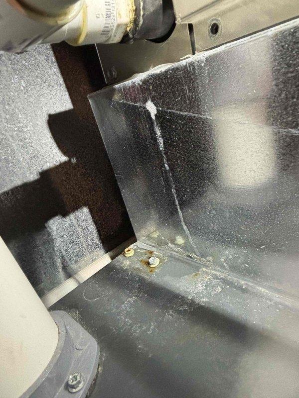 Completed annual cooling maintenance on 8-year-old EcoAir system (2021 model). Inspected air handling unit and ductwork, noting significant condensation present on metal surfaces indicating proper cooling operation and high humidity conditions. Replaced heavily soiled air filter with new unit to restore proper airflow and system efficiency.
