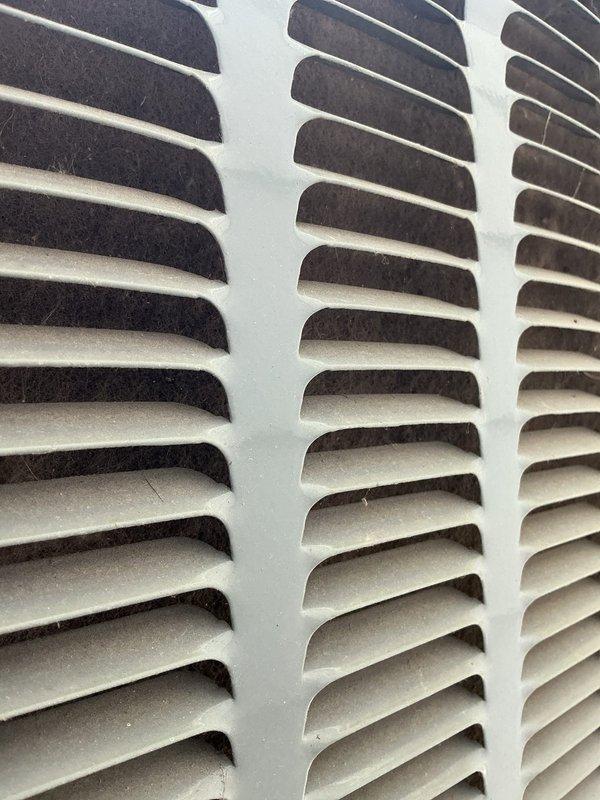 Completed comprehensive annual cooling system maintenance and inspection under 3-year ENERGIAIR warranty agreement. Performed standard AC tune-up procedures including system diagnostics, refrigerant level verification, electrical component testing, and condensate drainage system inspection. Documented mechanical room equipment configuration including condensate pump assembly with PVC discharge piping and drainage pan installation. Inspected return air ventilation grille showing moderate dust and debris accumulation in louvered sections; noted standard maintenance cleaning recommended to maintain optimal airflow efficiency. All HVAC components operating within manufacturer specifications at time of service completion.