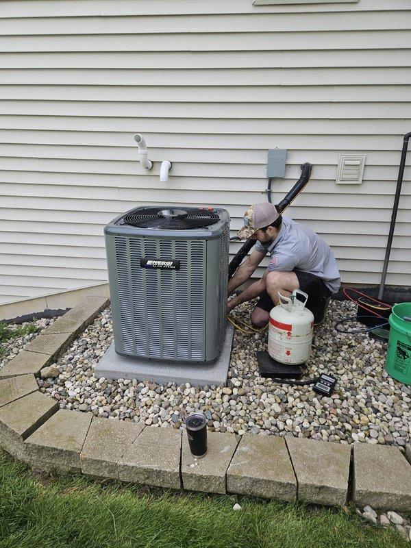 Completed full HVAC system installation including new furnace, air conditioning unit, and water heater at residential property. Installed outdoor AC condenser unit on concrete pad with proper refrigerant line connections, electrical conduit routing to junction box, and PVC drainage piping through exterior wall. Installed new residential water heater in basement utility area with copper supply line connections, brass shutoff valves, proper venting through metallic flue pipe, and drain pan placement per code requirements. All units tested, operational, and ready for service.