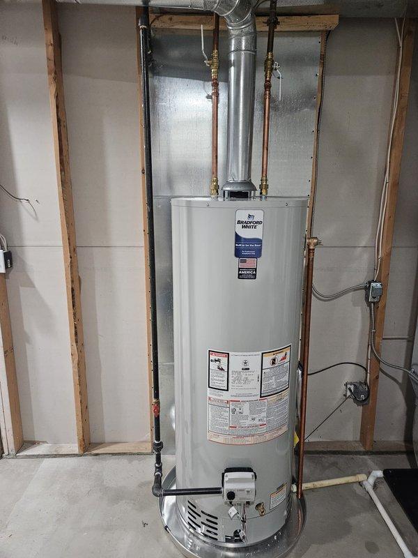 Completed full HVAC system installation including new furnace, air conditioning unit, and water heater at residential property. Installed outdoor AC condenser unit on concrete pad with proper refrigerant line connections, electrical conduit routing to junction box, and PVC drainage piping through exterior wall. Installed new residential water heater in basement utility area with copper supply line connections, brass shutoff valves, proper venting through metallic flue pipe, and drain pan placement per code requirements. All units tested, operational, and ready for service.