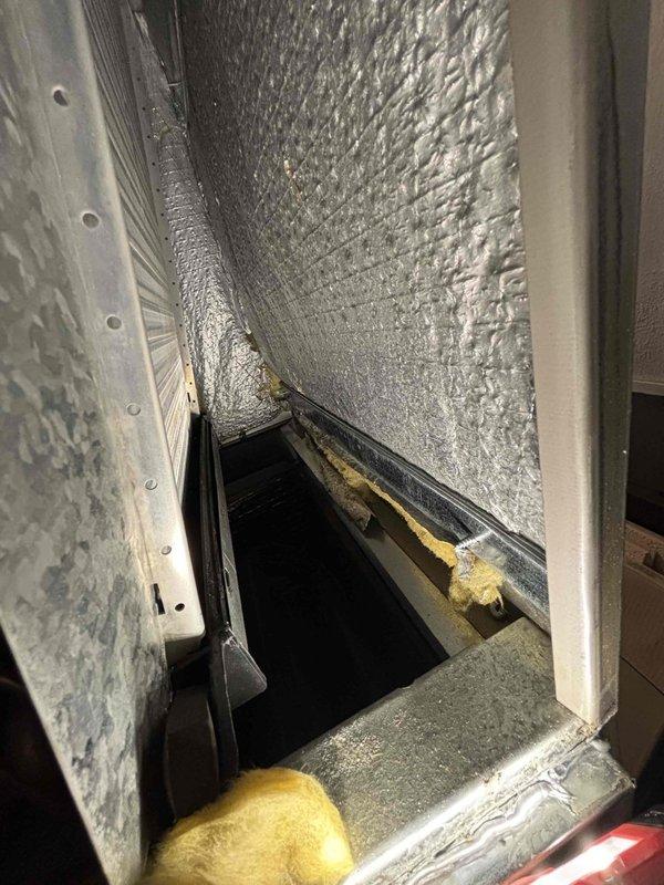 Responded to water leak complaint above furnace in mechanical room. Upon inspection, identified condensate drainage issue from evaporator coil assembly on 22-year-old Carrier HVAC system. Documented equipment condition with photographs showing heat exchanger coil configuration and interior ductwork with insulation. Assessed drainage system and provided findings to customer for necessary repairs.