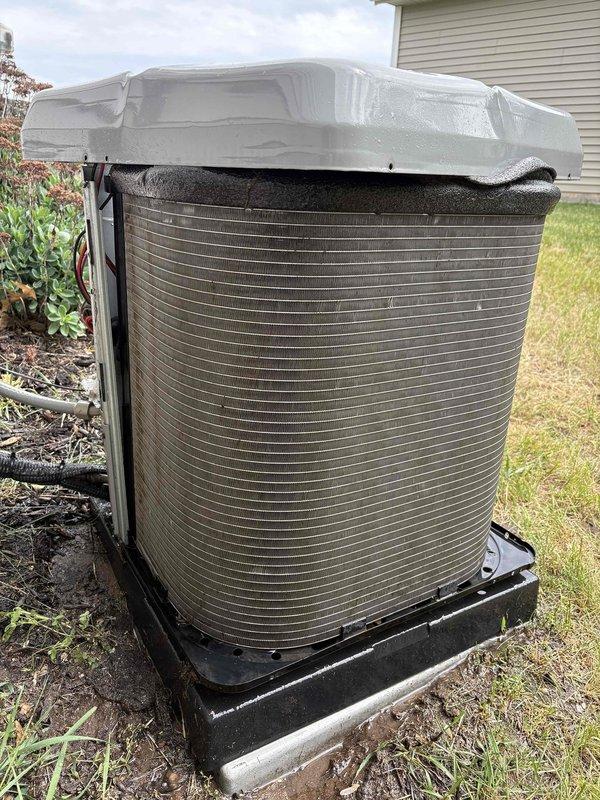 Completed annual cooling maintenance on 22-year-old Luxaire air conditioning system. Performed comprehensive tune-up inspection of outdoor condenser unit, which showed significant dirt and debris accumulation on exterior coil fins requiring attention. Unit is equipped with protective winter cover and positioned on appropriate base pad with proper drainage. System operational and ready for cooling season.