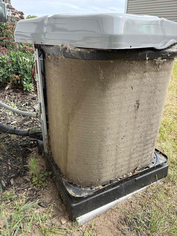 Completed annual cooling maintenance on 22-year-old Luxaire air conditioning system. Performed comprehensive tune-up inspection of outdoor condenser unit, which showed significant dirt and debris accumulation on exterior coil fins requiring attention. Unit is equipped with protective winter cover and positioned on appropriate base pad with proper drainage. System operational and ready for cooling season.